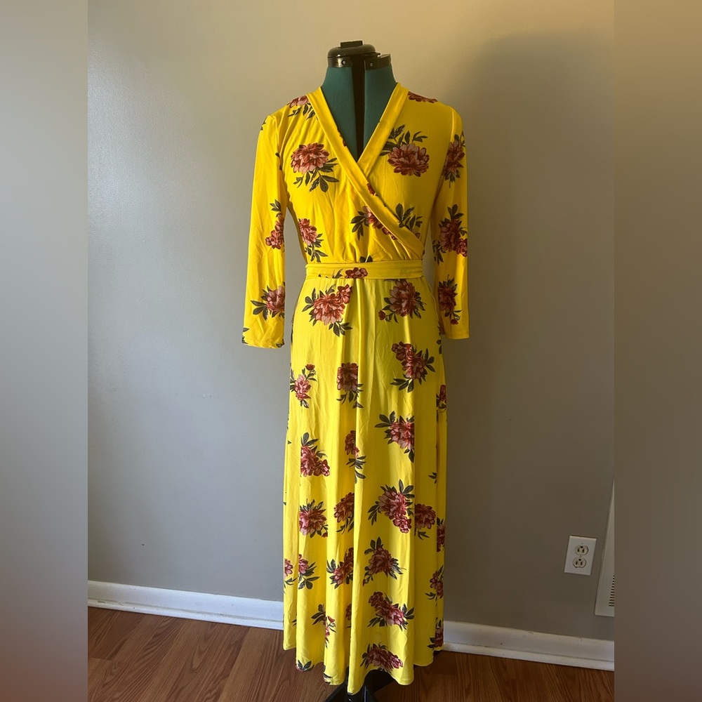 Size medium, very bright yellow with floral designs, polyester